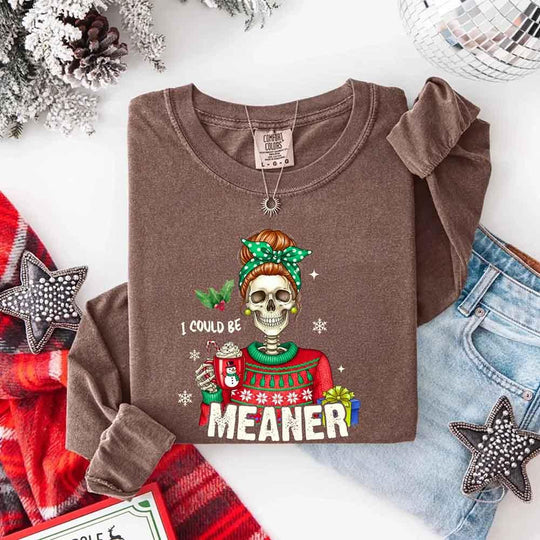 May include a Comfort Colors long sleeve shirt featuring the phrase “I Could Be Meaner” in festive Christmas design, displayed flat with soft cotton texture and holiday accents.