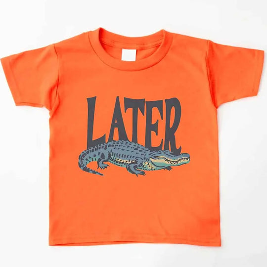 May include an orange color kids' T-shirt with "LATER" and a cartoon alligator