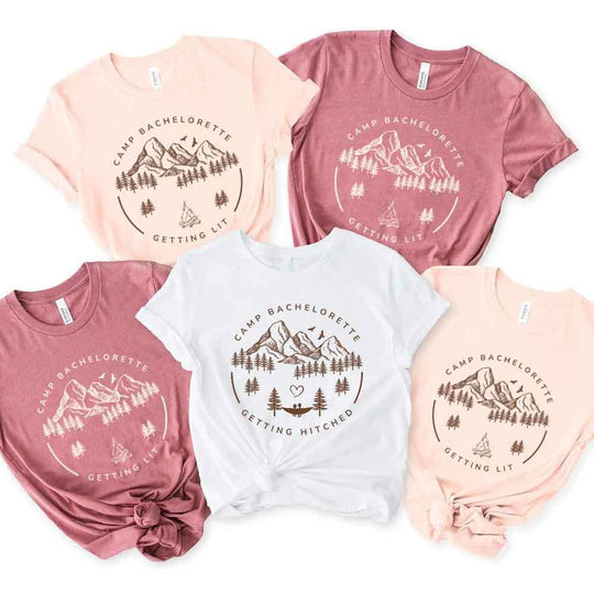 May include camp themed Bachelorette t shirts with fun outdoor slogans cozy vibes bridal squad outfits perfect for camping trip celebrations and girls getaway!