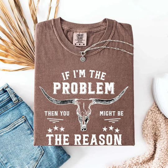 May include a Comfort Colors unisex Western shirt with “If I’m The Problem Then You Might Be The Reason” text, styled with vintage country flair.