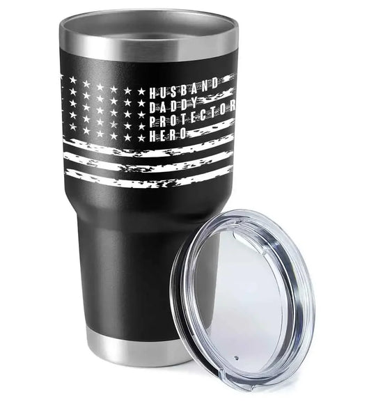 Black stainless steel travel tumbler with American flag design and 'Husband Daddy Protector Hero' text
