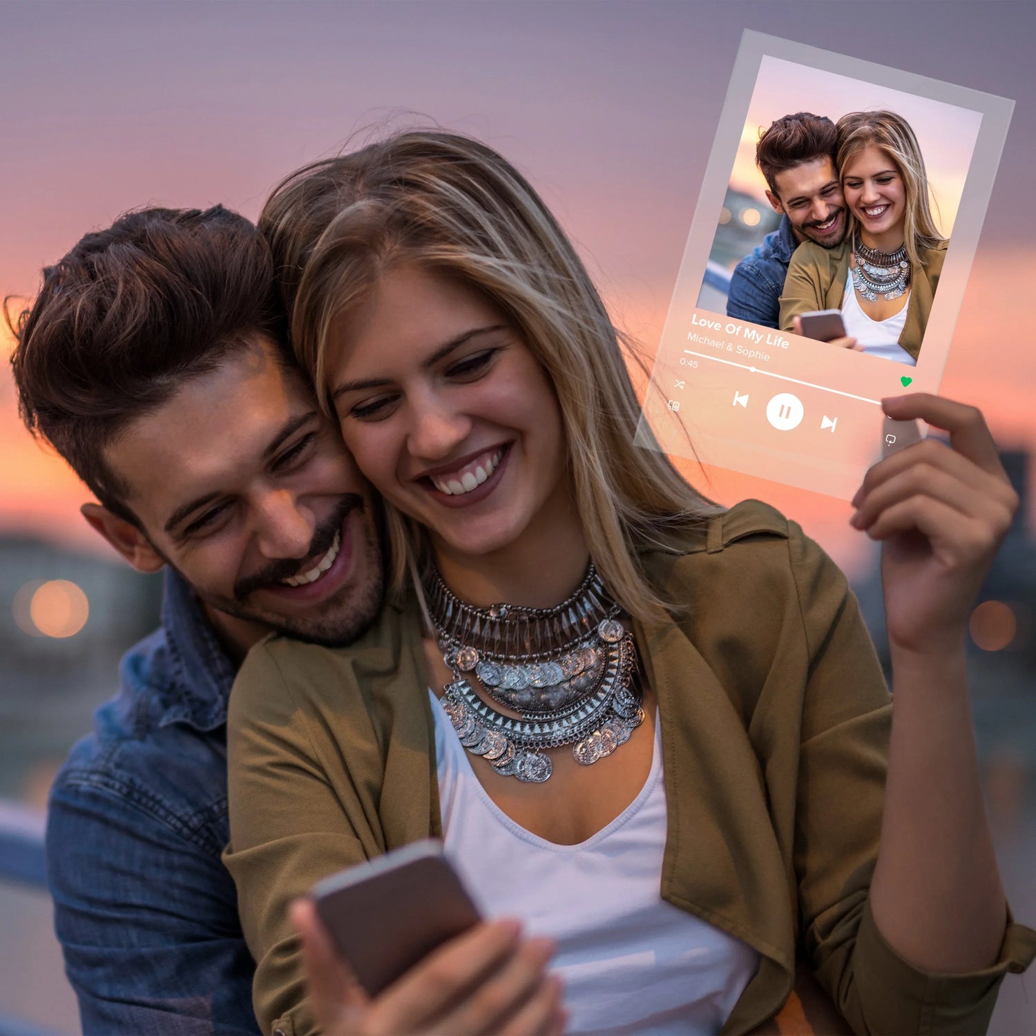 Couple smiling at sunset holding custom acrylic music plaque with photo and song title.