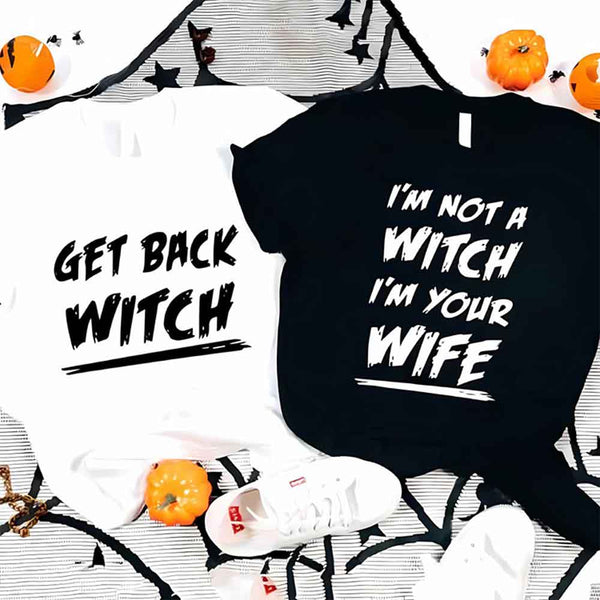 May include matching couple Halloween shirts with bold text, one reading ‘Get Back Witch’ and the other ‘I’m Not a Witch, I’m Your Wife’ – funny spooky graphic tees for couples.
