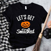 May include matching couple Halloween shirts with bold text, one reading ‘Let’s Get Smashed’ with jack-o’-lantern graphic on white tee, and the other reading ‘Let’s Get Sheet Faced’ with ghost graphic on black tee – funny spooky couple apparel.