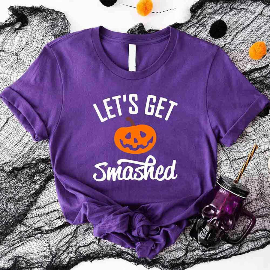 May include matching couple Halloween shirts with bold text, one reading ‘Let’s Get Smashed’ with jack-o’-lantern graphic on white tee, and the other reading ‘Let’s Get Sheet Faced’ with ghost graphic on black tee – funny spooky couple apparel.