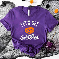 May include matching couple Halloween shirts with bold text, one reading ‘Let’s Get Smashed’ with jack-o’-lantern graphic on white tee, and the other reading ‘Let’s Get Sheet Faced’ with ghost graphic on black tee – funny spooky couple apparel.