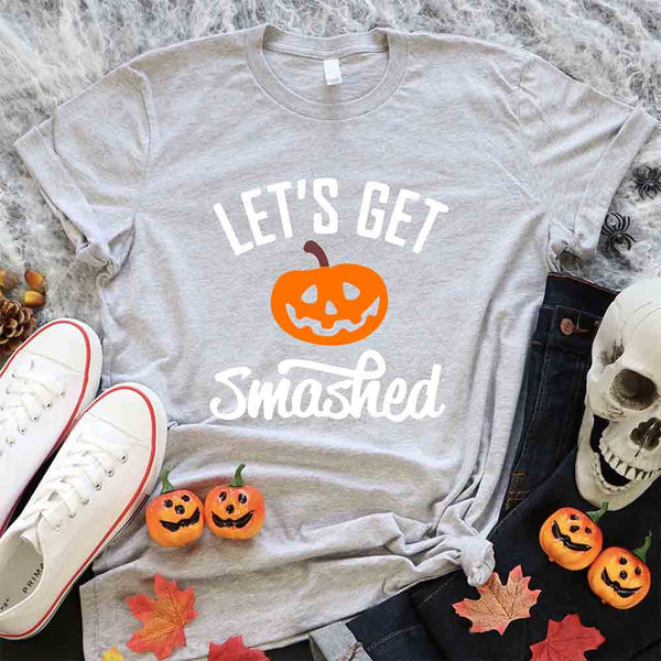 May include matching couple Halloween shirts with bold text, one reading ‘Let’s Get Smashed’ with jack-o’-lantern graphic on white tee, and the other reading ‘Let’s Get Sheet Faced’ with ghost graphic on black tee – funny spooky couple apparel.