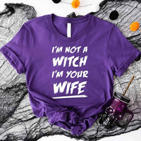 May include matching couple Halloween shirts with bold text, one reading ‘Get Back Witch’ and the other ‘I’m Not a Witch, I’m Your Wife’ – funny spooky graphic tees for couples.