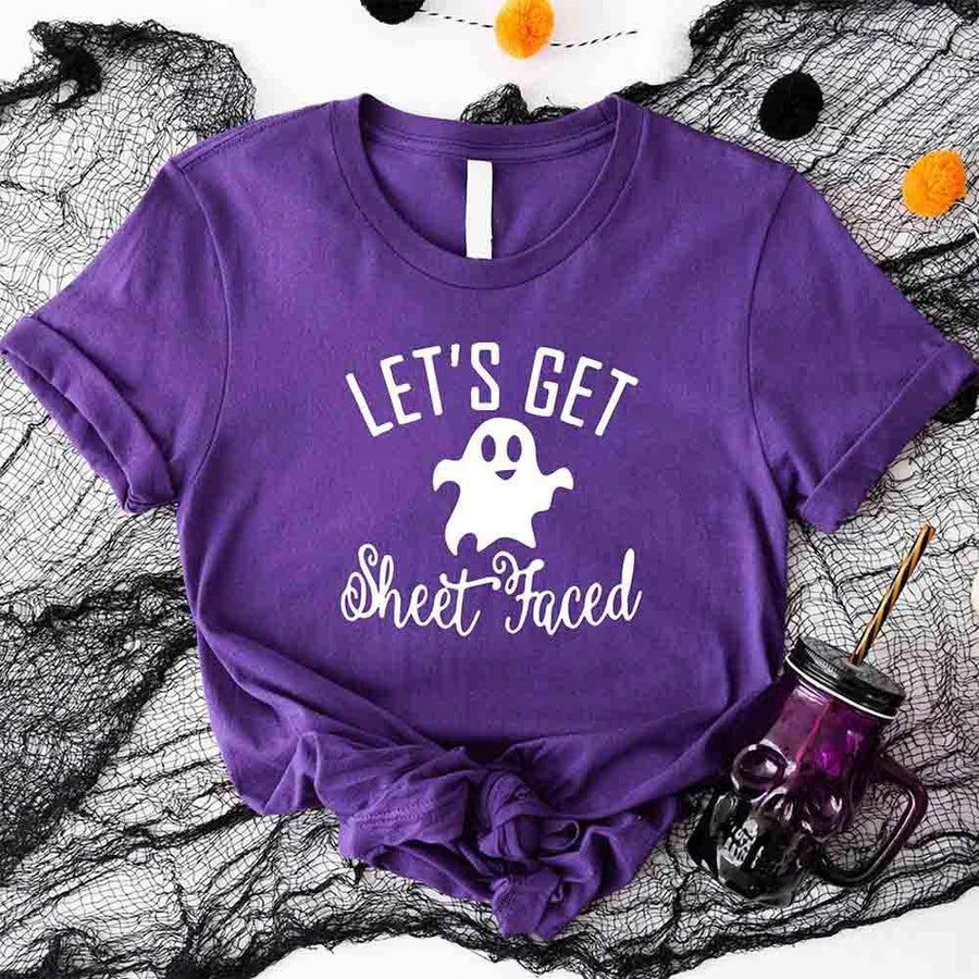 May include matching couple Halloween shirts with bold text, one reading ‘Let’s Get Smashed’ with jack-o’-lantern graphic on white tee, and the other reading ‘Let’s Get Sheet Faced’ with ghost graphic on black tee – funny spooky couple apparel.
