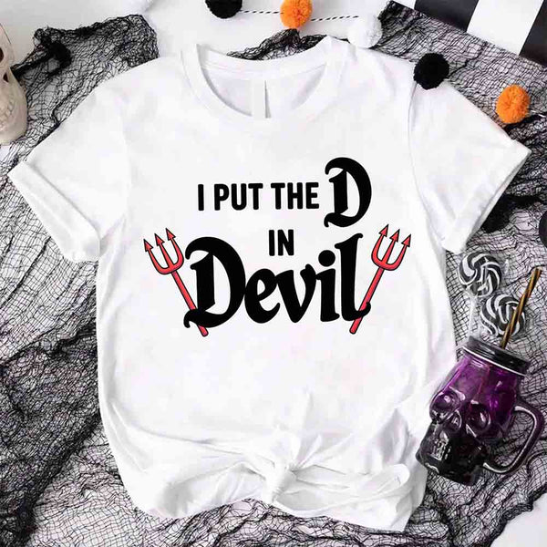 May include matching couple Halloween shirts, one with text ‘I Put the D in Devil’ in white with pitchfork graphic, and the other with bold red ‘Devil’ text featuring horns and tail – funny spooky couple tees.