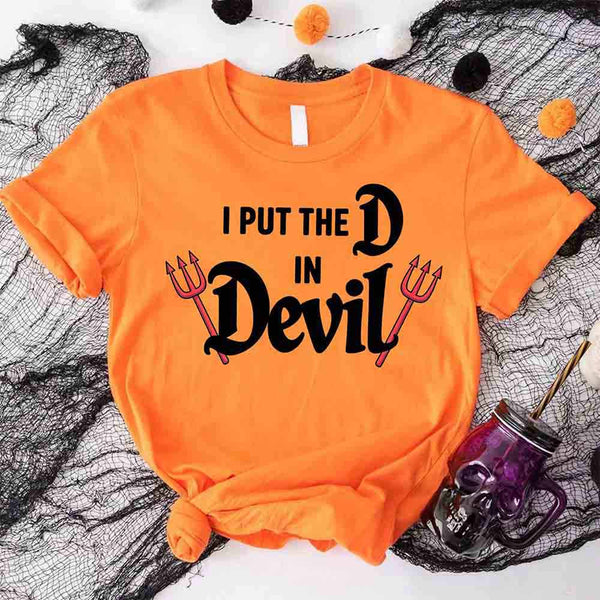May include matching couple Halloween shirts, one with text ‘I Put the D in Devil’ in white with pitchfork graphic, and the other with bold red ‘Devil’ text featuring horns and tail – funny spooky couple tees.
