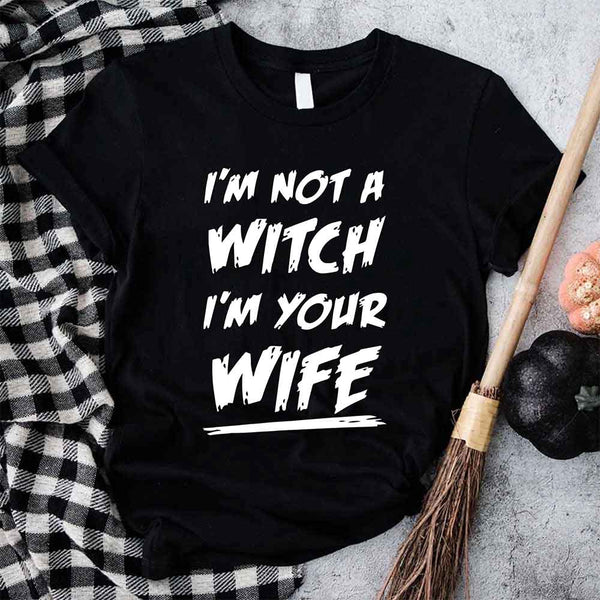May include matching couple Halloween shirts with bold text, one reading ‘Get Back Witch’ and the other ‘I’m Not a Witch, I’m Your Wife’ – funny spooky graphic tees for couples.