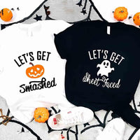 May include matching couple Halloween shirts with bold text, one reading ‘Let’s Get Smashed’ with jack-o’-lantern graphic on white tee, and the other reading ‘Let’s Get Sheet Faced’ with ghost graphic on black tee – funny spooky couple apparel.