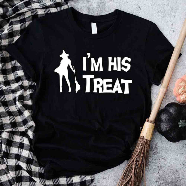 May include matching couple Halloween shirts with bold white text, one reading ‘I’m Her Trick’ with ghost graphic on orange tee, and the other reading ‘I’m His Treat’ with witch silhouette on black tee – funny spooky couple apparel.