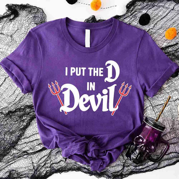 May include matching couple Halloween shirts, one with text ‘I Put the D in Devil’ in white with pitchfork graphic, and the other with bold red ‘Devil’ text featuring horns and tail – funny spooky couple tees.