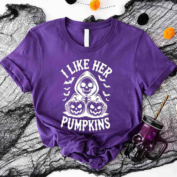 May include matching couple Halloween shirts, one with skeleton and pumpkins graphic reading ‘I Like Her Pumpkins,’ and the other with skeleton witch flying on broom reading ‘I Like His Broomstick’ – funny spooky couple tees.