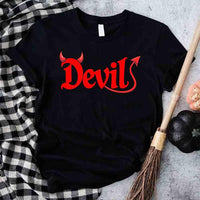 Black t-shirt with red 'Devil' text on a checkered fabric background