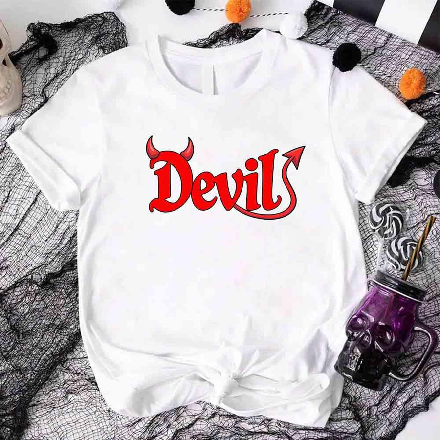 White t-shirt with 'Devil' printed in red on a Halloween-themed background.