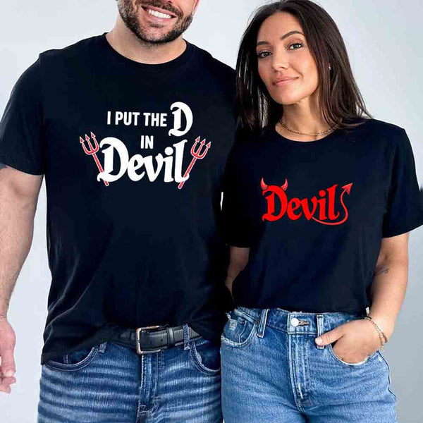 May include matching couple Halloween shirts, one with text ‘I Put the D in Devil’ in white with pitchfork graphic, and the other with bold red ‘Devil’ text featuring horns and tail – funny spooky couple tees.