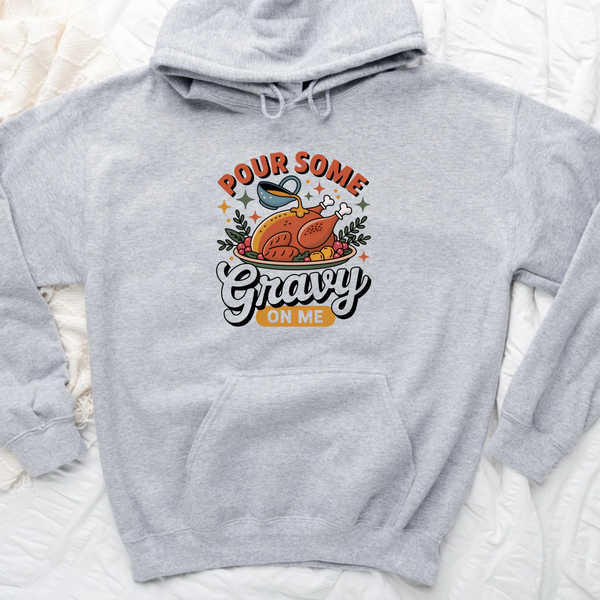 Gray hoodie with a graphic of a turkey and text 'Pour some gravy on me' on a white background