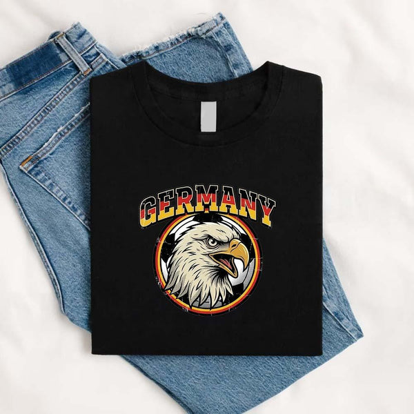 May include a person wearing a Black  Germany 2026 World Cup Countries Animal Emblems T-Shirt featuring bold animal graphic and relaxed fit.