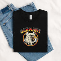 May include a person wearing a Black  Germany 2026 World Cup Countries Animal Emblems T-Shirt featuring bold animal graphic and relaxed fit.