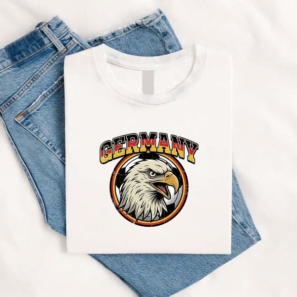 May include a person wearing a White Germany 2026 World Cup Countries Animal Emblems T-Shirt featuring bold animal graphic and relaxed fit.