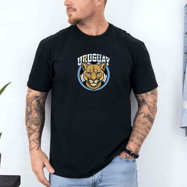 Man wearing black Uruguay soccer fan t-shirt with puma graphic and country name emblem.