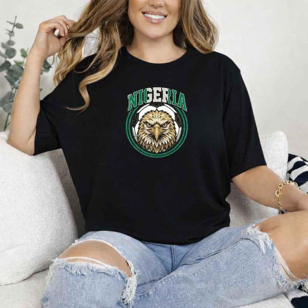Woman wearing black Nigeria soccer fan t-shirt with eagle graphic emblem