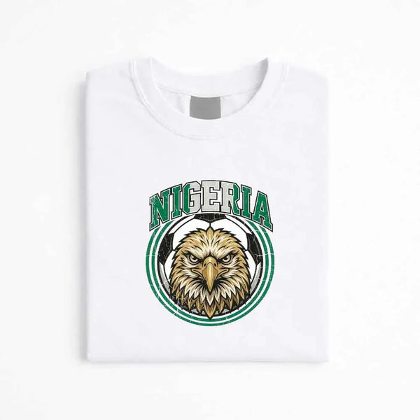 White Nigeria soccer fan T-shirt with eagle and soccer ball graphic emblem.