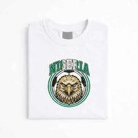 White Nigeria soccer fan T-shirt with eagle and soccer ball graphic emblem.