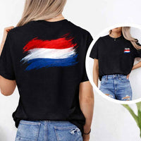 May include a person wearing a Black Netherlands 2026 World Cup "Countries" T-Shirt – Soccer Fan Graphic Tee featuring bold soccer countries graphic and relaxed fit.