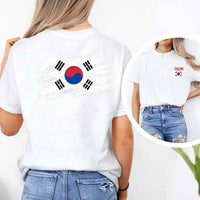 May include a person wearing a White South Korea 2026 World Cup "Countries" T-Shirt – Soccer Fan Graphic Tee featuring bold soccer countries graphic and relaxed fit.