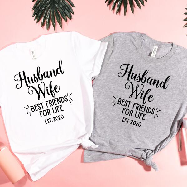 White and gray t-shirts with 'Husband Wife Best Friends for Life Est. 2020' text on a pink background.
