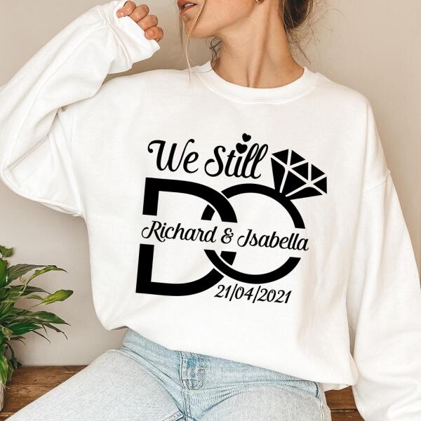 White sweatshirt with 'We Still Do' design and personalized text worn by a person.