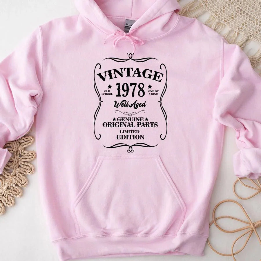 May include a personalized vintage-style birthday T-shirt with the words Well Aged and a custom year printed on the front.
