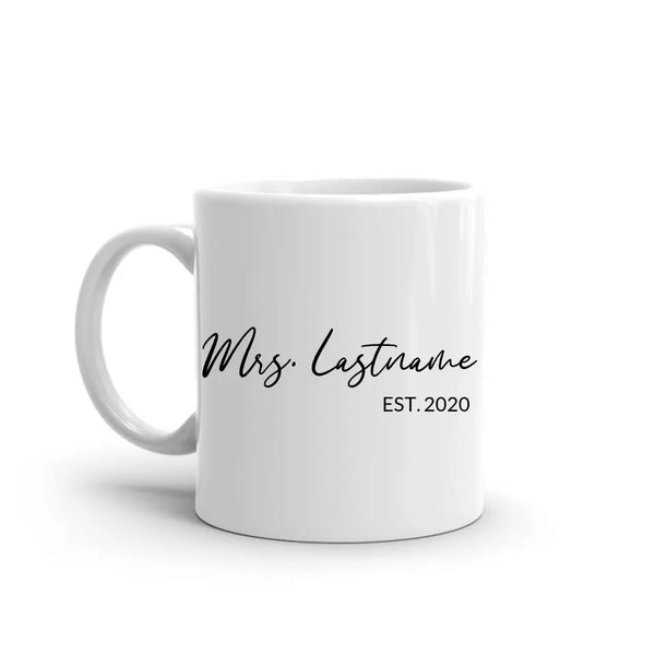 White mug with 'Mrs. Lastname EST. 2020' text on a white background