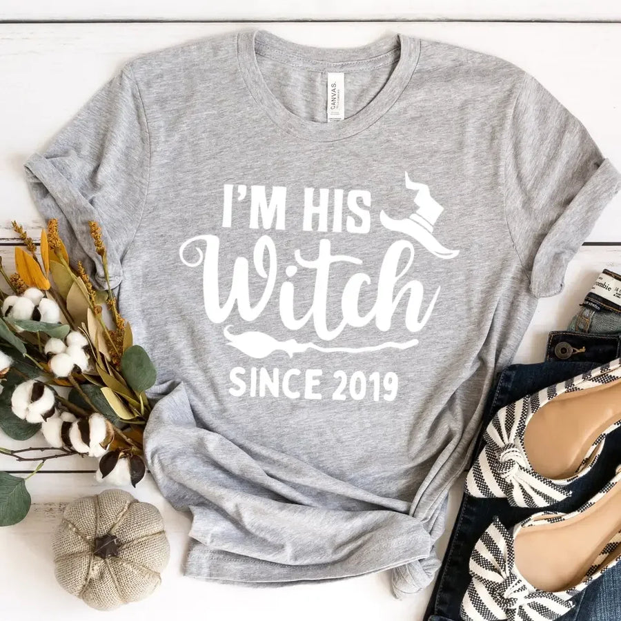 Gray Halloween t-shirt with 'I'm his witch since 2019' text