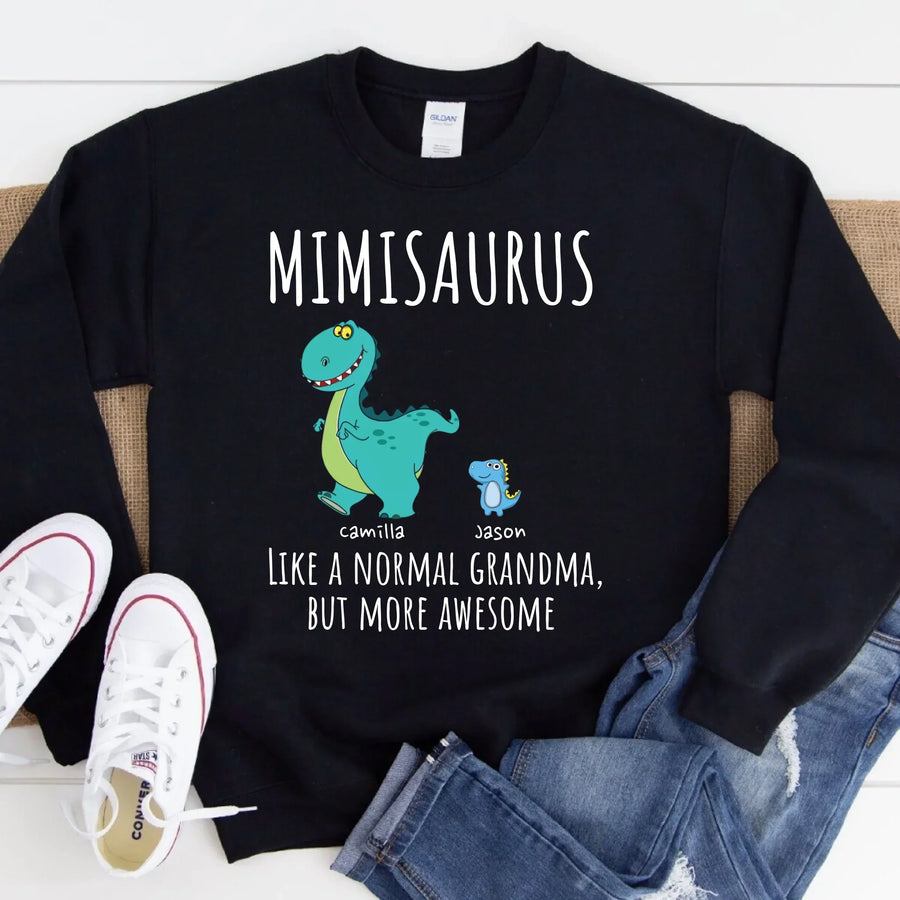 Black t-shirt with a colorful dinosaur design and text 'MIMISARUS like a normal grandma, but more awesome' along with three names: Camilla, Jason, and Mike. 