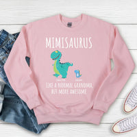 Black t-shirt with a colorful dinosaur design and text 'MIMISARUS like a normal grandma, but more awesome' along with three names: Camilla, Jason, and Mike. 