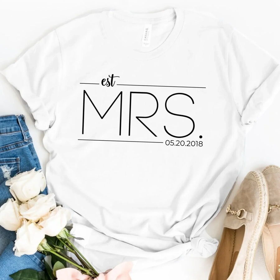 A white crew neck t-shirt with the text 'est. MRS.