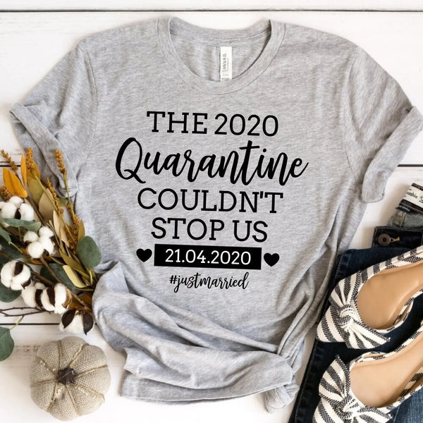 Gray custom tee with 'The 2020 Quarantine Couldn't Stop Us' text, date, and #justmarried, styled with accessories.
