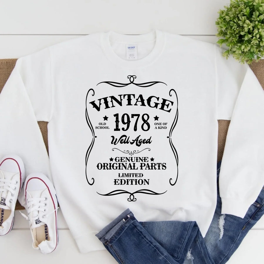 May include a personalized vintage-style birthday T-shirt with the words Well Aged and a custom year printed on the front.