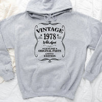 May include a personalized vintage-style birthday T-shirt with the words Well Aged and a custom year printed on the front.