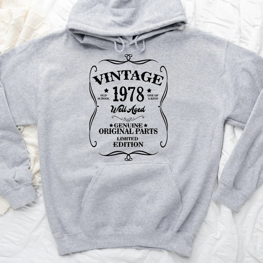 May include a personalized vintage-style birthday T-shirt with the words Well Aged and a custom year printed on the front.