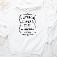 May include a personalized vintage-style birthday T-shirt with the words Well Aged and a custom year printed on the front.