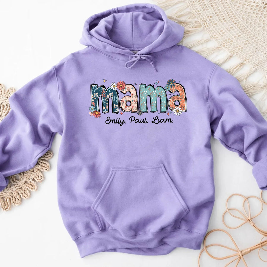 Purple hoodie with 'mama' text on a textured surface