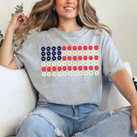 Woman wearing a gray t-shirt with a floral American flag graphic, casual jeans outfit