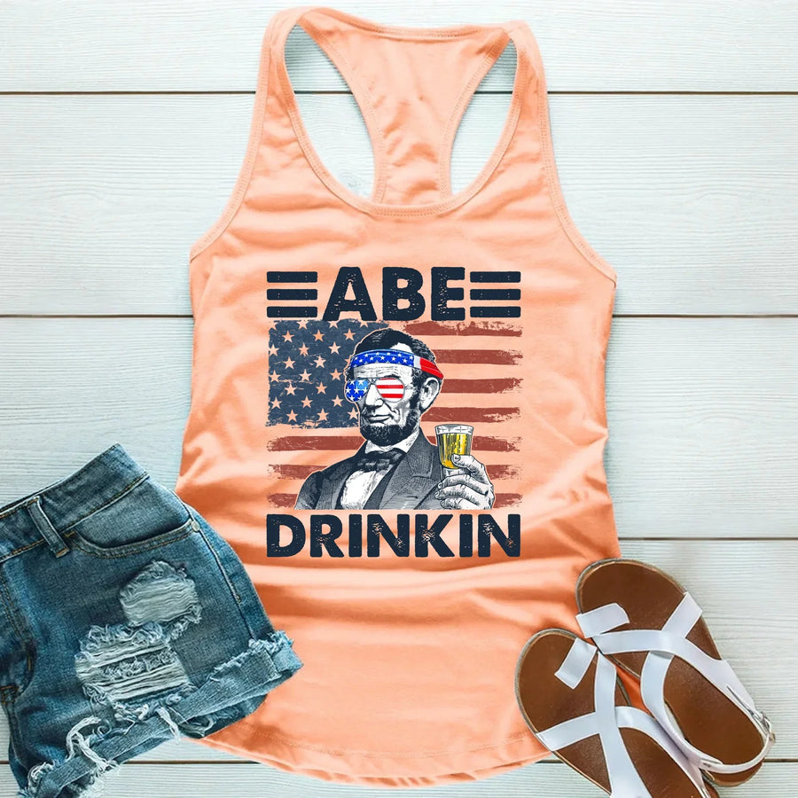 Peach tank top with vintage American flag, sunglasses, Abraham Lincoln, and 'Abe Drinkin' text