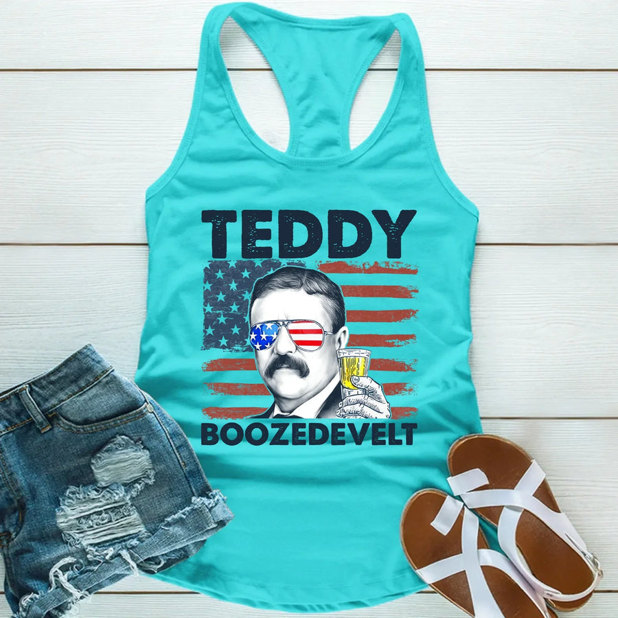 Turquoise tank top with a graphic of a man holding a drink, American flag, and text on a wooden surface.